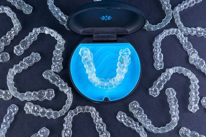 Clear orthodontic aligner trays with a protective case